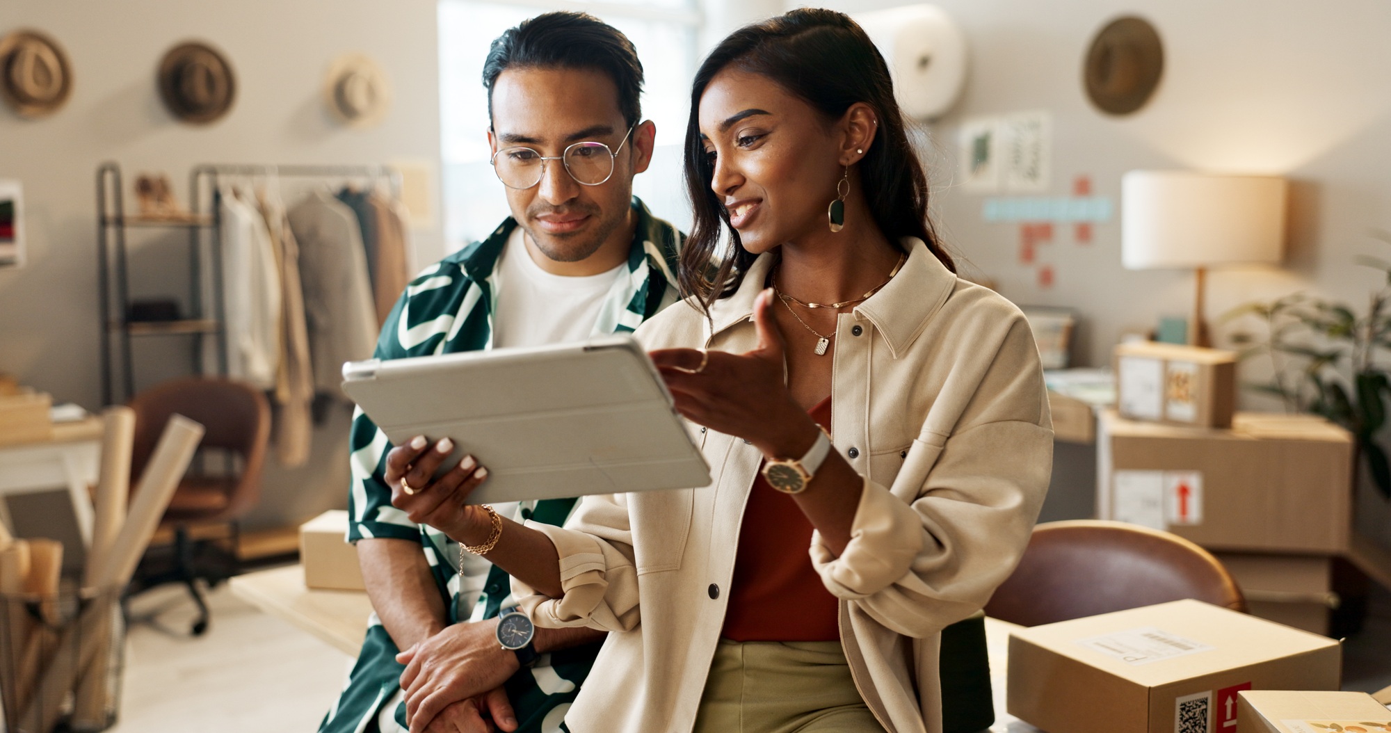 Business people, tablet and fashion designer in teamwork for planning, strategy or ideas in logisti