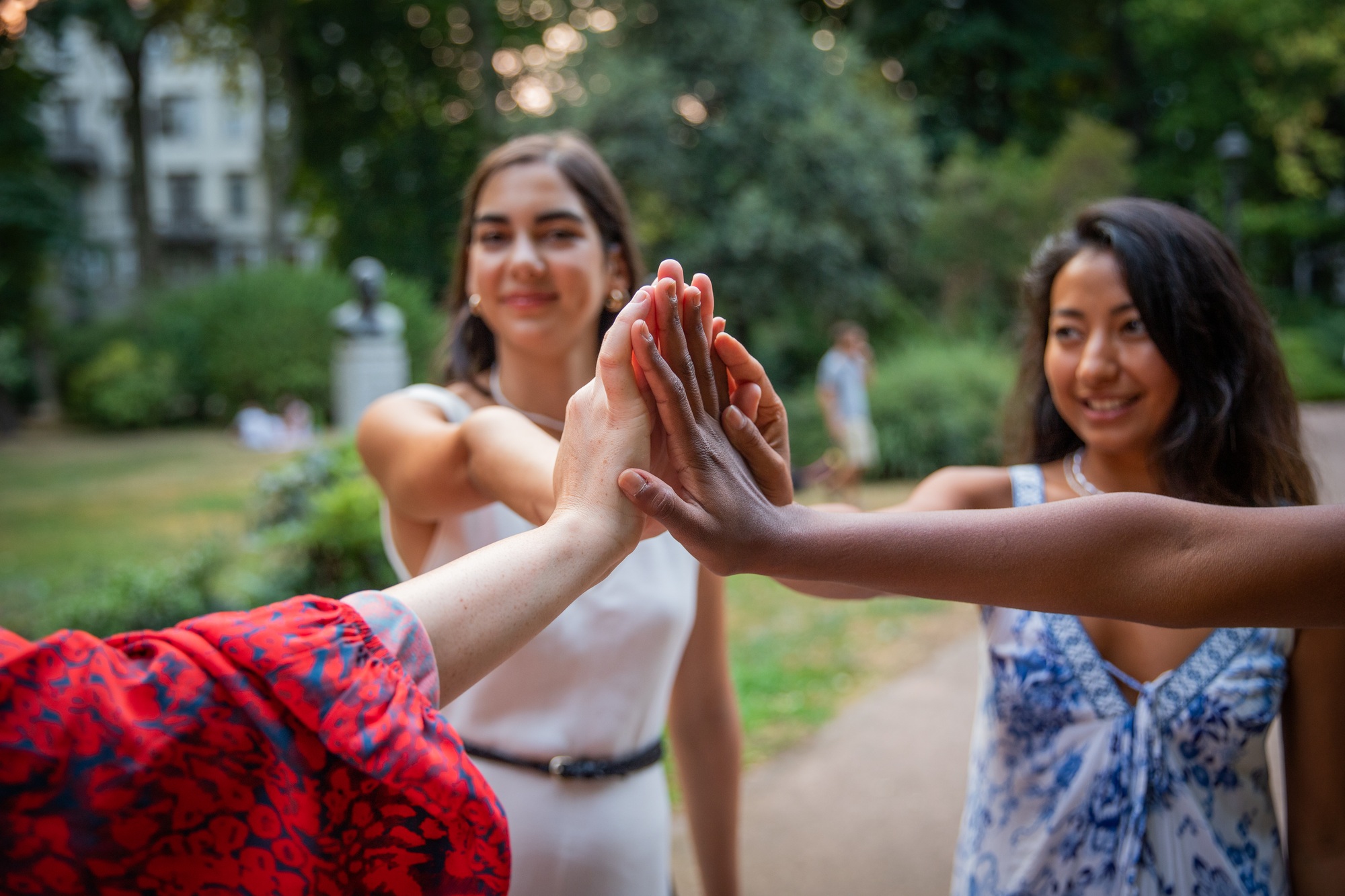 Close-up of the hands of girls of different ethnicities who put their hands together, integration.